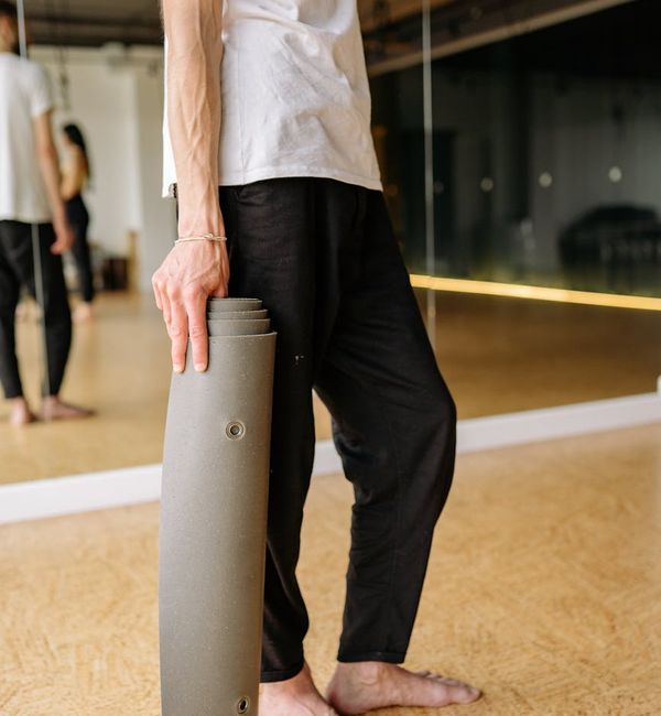 Person holding a challenging yoga balance pose, showing strength.